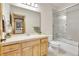 Bright bathroom featuring a glass-enclosed shower and beautiful wood cabinetry at 1294 Red Lodge Dr, Evergreen, CO 80439