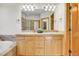 Bathroom showcasing a vanity with double sinks and a walk-in shower at 1294 Red Lodge Dr, Evergreen, CO 80439