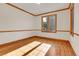 Bright bedroom featuring hardwood floors, natural light, and wood trim at 1294 Red Lodge Dr, Evergreen, CO 80439