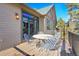 Outdoor patio space with a metal patio set and view of the home's exterior and surrounding trees at 1294 Red Lodge Dr, Evergreen, CO 80439