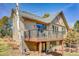 Attractive home exterior with a balcony, windows, and private views at 1294 Red Lodge Dr, Evergreen, CO 80439