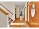 Bright foyer with wood floors and a view through to back patio doors at 1294 Red Lodge Dr, Evergreen, CO 80439