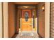 Inviting front door with decorative wreath and wood-look accents at 1294 Red Lodge Dr, Evergreen, CO 80439