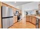 Spacious kitchen with stainless steel appliances and wooden cabinets, offering ample storage and workspace at 1294 Red Lodge Dr, Evergreen, CO 80439