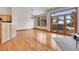 Bright living room featuring hardwood floors, a chandelier, and a sliding glass door leading to a deck at 1294 Red Lodge Dr, Evergreen, CO 80439