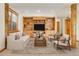 Comfortable living room with custom built-ins and abundant shelving, a cozy atmosphere to relax at 1294 Red Lodge Dr, Evergreen, CO 80439