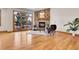 Bright living room with hardwood floors, stone fireplace, and large window at 1294 Red Lodge Dr, Evergreen, CO 80439