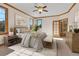Cozy main bedroom with natural lighting, ceiling fan, and a connecting bath at 1294 Red Lodge Dr, Evergreen, CO 80439