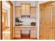Wooden office nook featuring drawers and cabinet storage at 1294 Red Lodge Dr, Evergreen, CO 80439