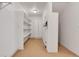 Well-lit storage room with white shelves and carpeted floor, providing ample space at 1294 Red Lodge Dr, Evergreen, CO 80439