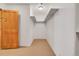 Spacious walk-in closet with shelving and a wood door at 1294 Red Lodge Dr, Evergreen, CO 80439