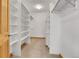 Spacious walk-in closet with built-in shelving and ample storage space at 1294 Red Lodge Dr, Evergreen, CO 80439