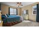 Bright bedroom with a queen bed, dresser, and window at 1303 Yellow Granite Way, Monument, CO 80132