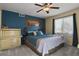 Spacious bedroom with teal walls and a king-size bed at 1303 Yellow Granite Way, Monument, CO 80132