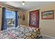 Spacious bedroom with a cowhide print blanket and window view at 1303 Yellow Granite Way, Monument, CO 80132