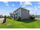 Two-story home with gray siding and landscaped yard at 1303 Yellow Granite Way, Monument, CO 80132