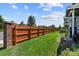 Wooden privacy fence and brick pillars along the lawn at 1303 Yellow Granite Way, Monument, CO 80132