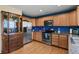 Kitchen features stainless steel appliances and wood cabinets at 1303 Yellow Granite Way, Monument, CO 80132