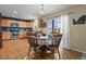 Kitchen with wood cabinets, stainless steel appliances, and a dining area at 1303 Yellow Granite Way, Monument, CO 80132