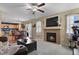 Open floor plan living room with kitchen and fireplace views at 1303 Yellow Granite Way, Monument, CO 80132