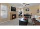 Living room with fireplace, comfortable seating, and a cat tree at 1303 Yellow Granite Way, Monument, CO 80132