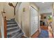 Staircase with carpet runner and wooden handrail at 1303 Yellow Granite Way, Monument, CO 80132