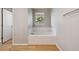 Bright bathroom featuring a large soaking tub and tile surround at 10480 Truckee St # B, Commerce City, CO 80022
