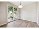 Bright dining area with sliding glass door, leading to outdoor patio at 10480 Truckee St # B, Commerce City, CO 80022