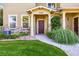Inviting front entryway with beautiful landscaping and exterior stone accents at 10480 Truckee St # B, Commerce City, CO 80022