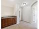 Hallway with a tile-top cabinet in alcove and carpet floors at 10480 Truckee St # B, Commerce City, CO 80022