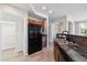 Well-equipped kitchen features stainless steel sink, granite countertops and modern black appliances at 10480 Truckee St # B, Commerce City, CO 80022
