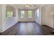 Bright open concept living room with large windows and hard surface floors at 10480 Truckee St # B, Commerce City, CO 80022