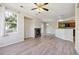 Spacious living room with fireplace and large window offering natural light at 10480 Truckee St # B, Commerce City, CO 80022