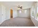 Spacious main bedroom with closet, ceiling fan and large windows offering ample natural light at 10480 Truckee St # B, Commerce City, CO 80022