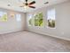 Spacious main bedroom with large windows offering ample natural light and ceiling fan at 10480 Truckee St # B, Commerce City, CO 80022