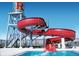 Fun pool area featuring a thrilling red water slide and refreshing water at 10480 Truckee St # B, Commerce City, CO 80022