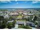 Aerial view of home with a nearby lake and commercial spaces, showcasing convenient location at 5172 S Cody Ct, Littleton, CO 80123
