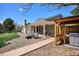 Backyard with outdoor kitchen, covered patio, and cozy seating, perfect for relaxing at 5172 S Cody Ct, Littleton, CO 80123