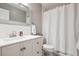 A beautifully updated bathroom with white subway tile, a modern vanity, and sleek fixtures at 5172 S Cody Ct, Littleton, CO 80123