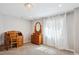 Bedroom featuring a classic wooden desk and dresser with natural light streaming in at 5172 S Cody Ct, Littleton, CO 80123