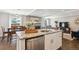 Beautiful kitchen with granite countertops, stainless steel appliances, and an open view to the dining and living areas at 5172 S Cody Ct, Littleton, CO 80123