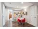 Playroom features hardwood floors, a ' table with red chairs, and wall-mounted art displays at 5172 S Cody Ct, Littleton, CO 80123