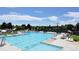 Community pool with clear blue water and ample seating, perfect for summer relaxation at 5172 S Cody Ct, Littleton, CO 80123
