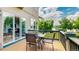 Outdoor deck with a view of a lake, and a dining table at 1647 Harris Ct, Erie, CO 80516