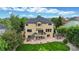 Backyard features a deck, patio, and a large grassy area at 1647 Harris Ct, Erie, CO 80516