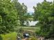 Scenic backyard view with a glimpse of the lake, lush greenery, garden, and a tranquil atmosphere at 1647 Harris Ct, Erie, CO 80516