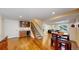Finished basement featuring a bar area, staircase, and hardwood floors at 1647 Harris Ct, Erie, CO 80516