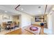 Spacious basement with multiple living areas and a large print wall decoration at 1647 Harris Ct, Erie, CO 80516