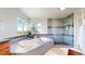 Well-lit bathroom with a relaxing soaking tub and glass-enclosed shower at 1647 Harris Ct, Erie, CO 80516