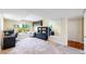 Well-lit bedroom with neutral carpet, large window, and ample closet space at 1647 Harris Ct, Erie, CO 80516